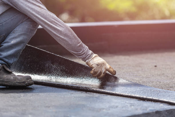 Professional Waterproofing technician working in Oswego, KS